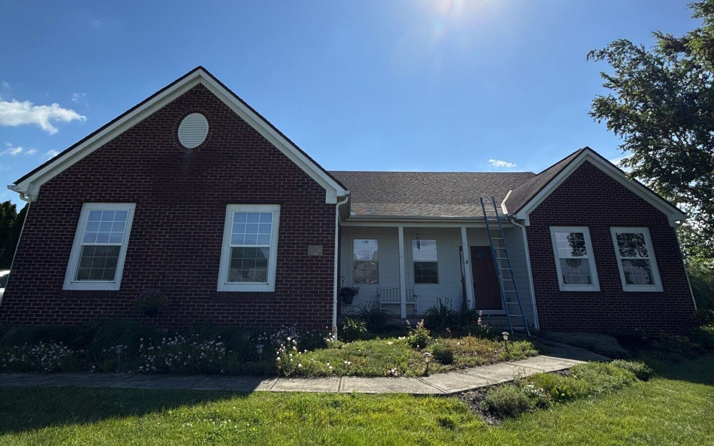 The brick front elevation before the new roof