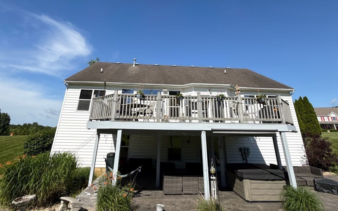 The rear elevation and walk-out deck before work began