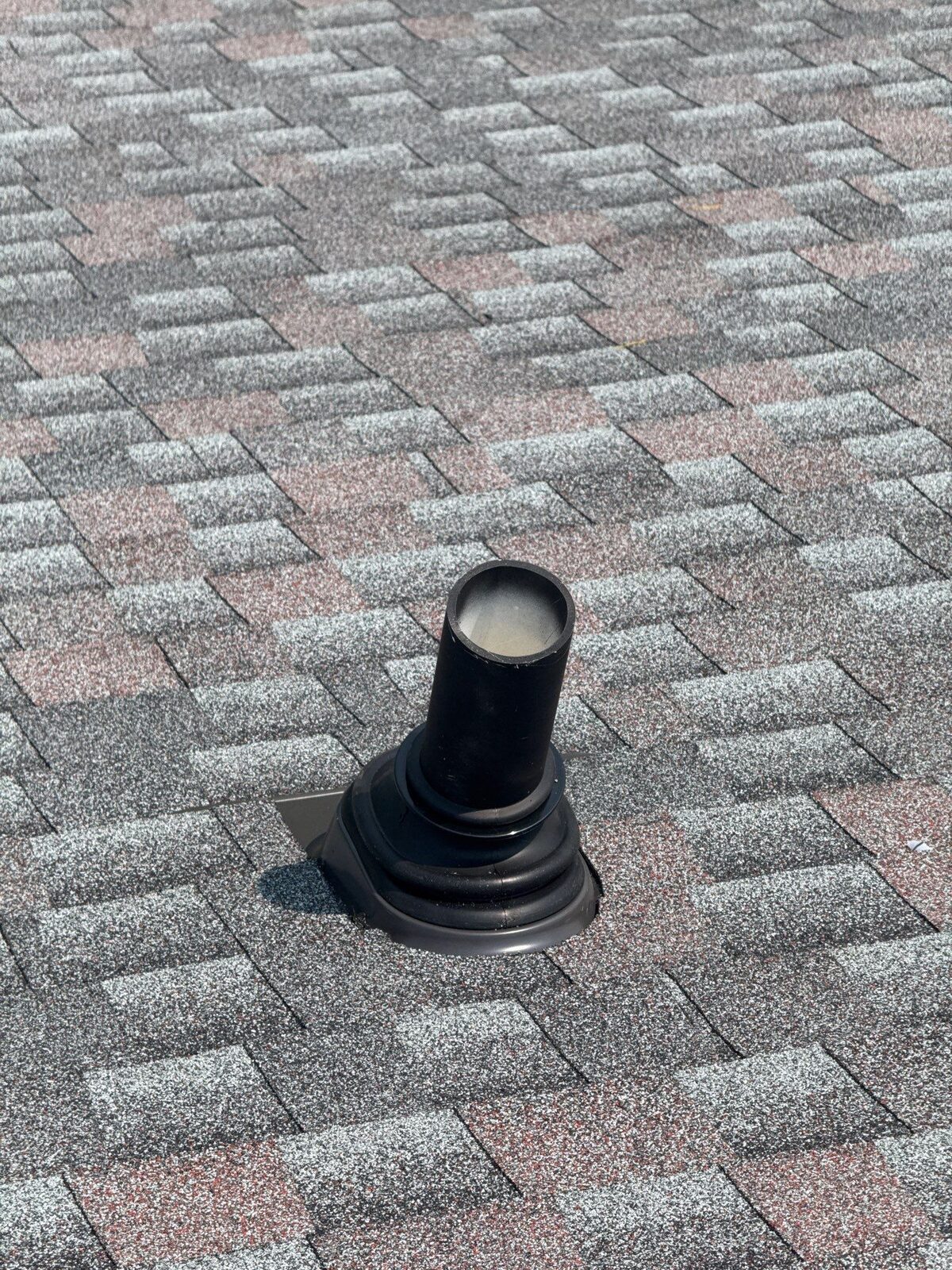 New pipe-boot flashing sealed into the shingles