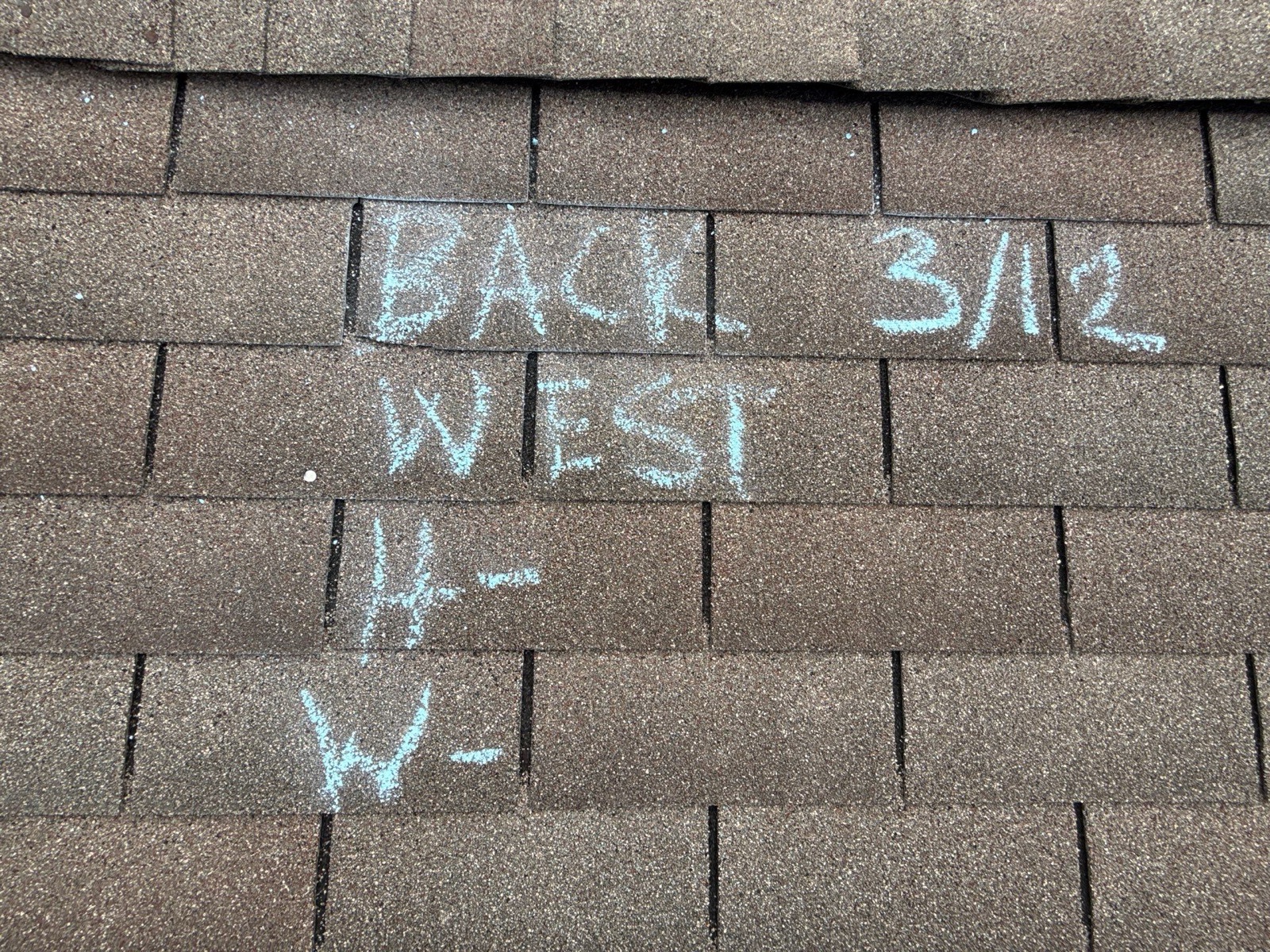 Wind damage chalk-marked slope by slope to document the insurance claim