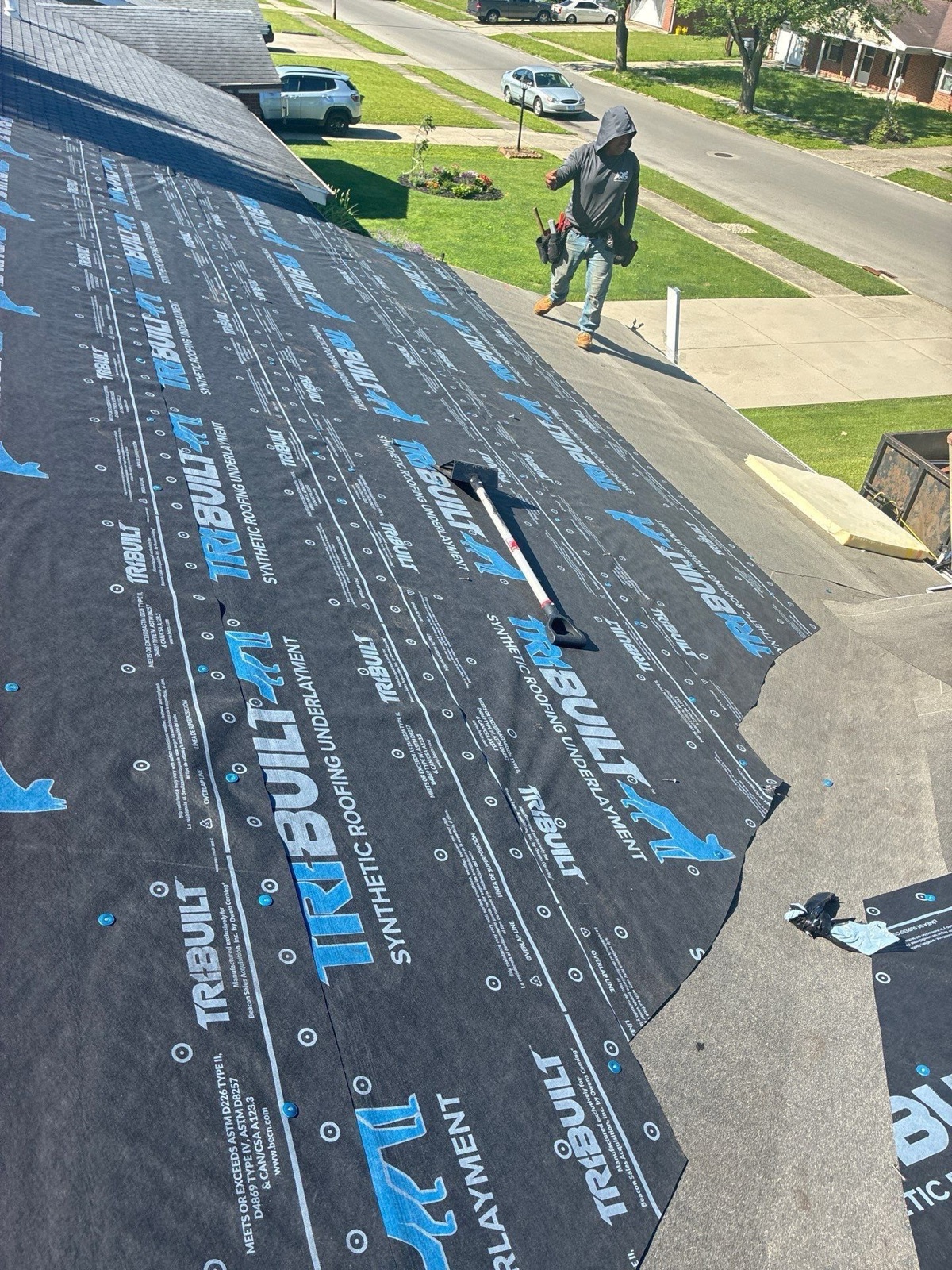 New synthetic underlayment laid across the roof