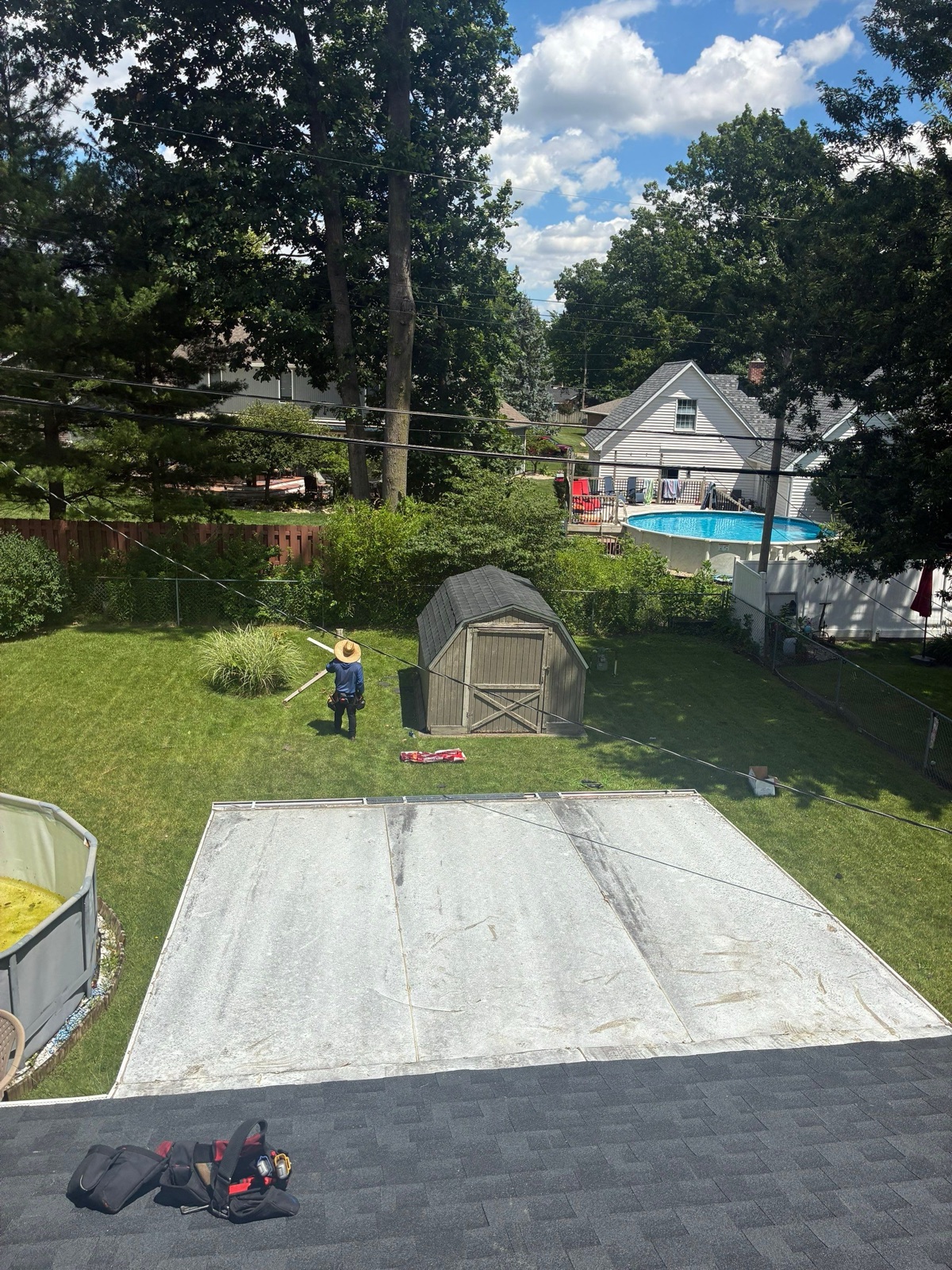 The backyard shed re-decked and re-roofed to match